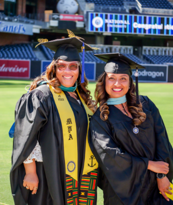 two proud female graduates  